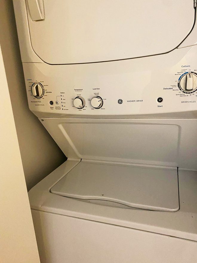 A clean stacked washer and dryer unit